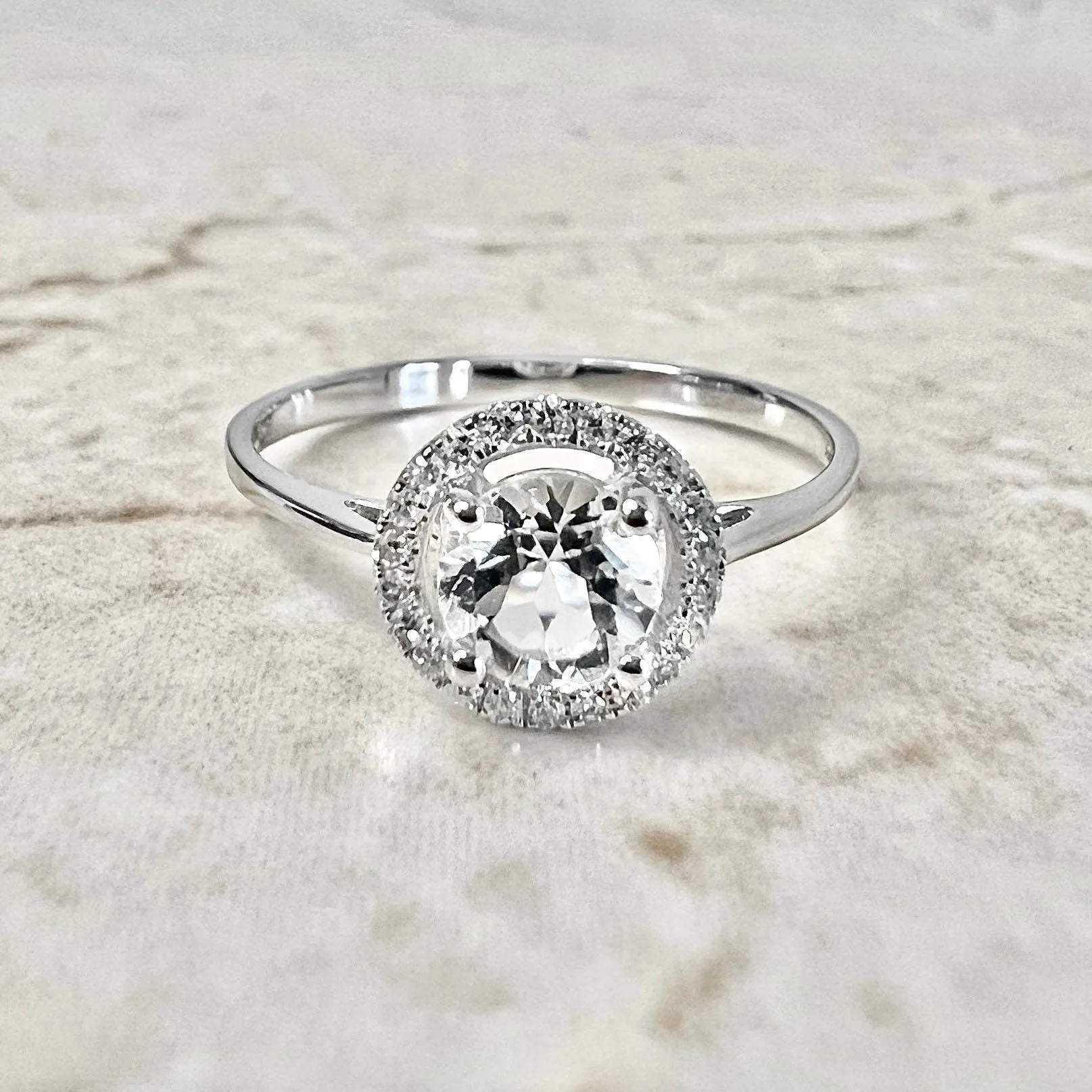 14 Karat White Gold April Birthstone Round White Topaz & Diamond Halo Ring