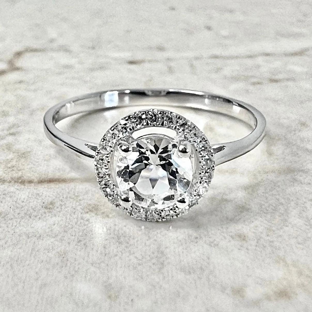 14 Karat White Gold April Birthstone Round White Topaz & Diamond Halo Ring