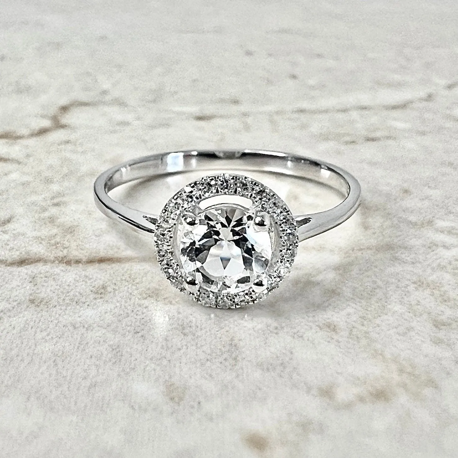 14 Karat White Gold April Birthstone Round White Topaz & Diamond Halo Ring