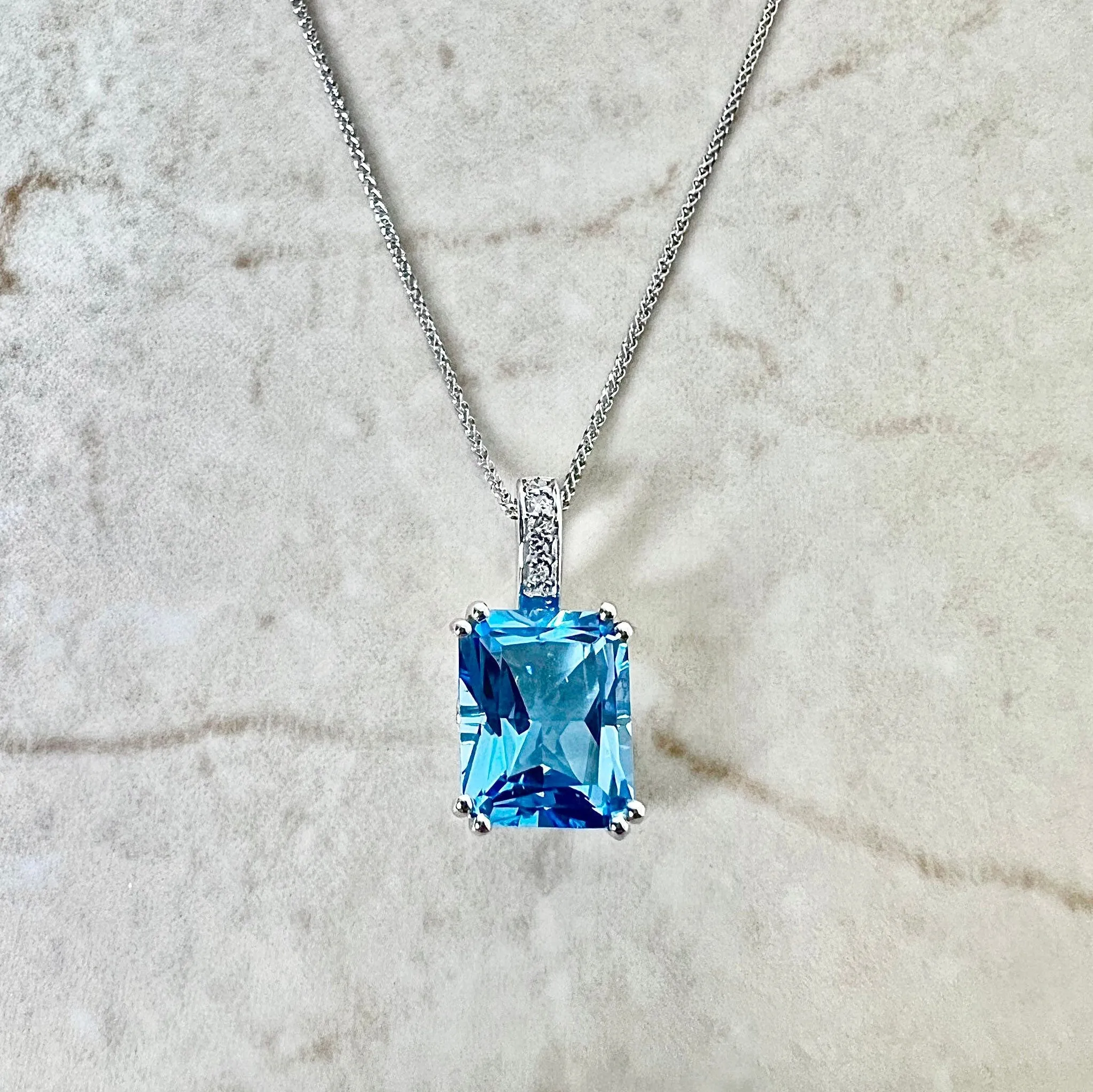 14 Karat White Gold Radiant Cut Swiss Blue Topaz & Diamond Ring And Pendant Necklace Set