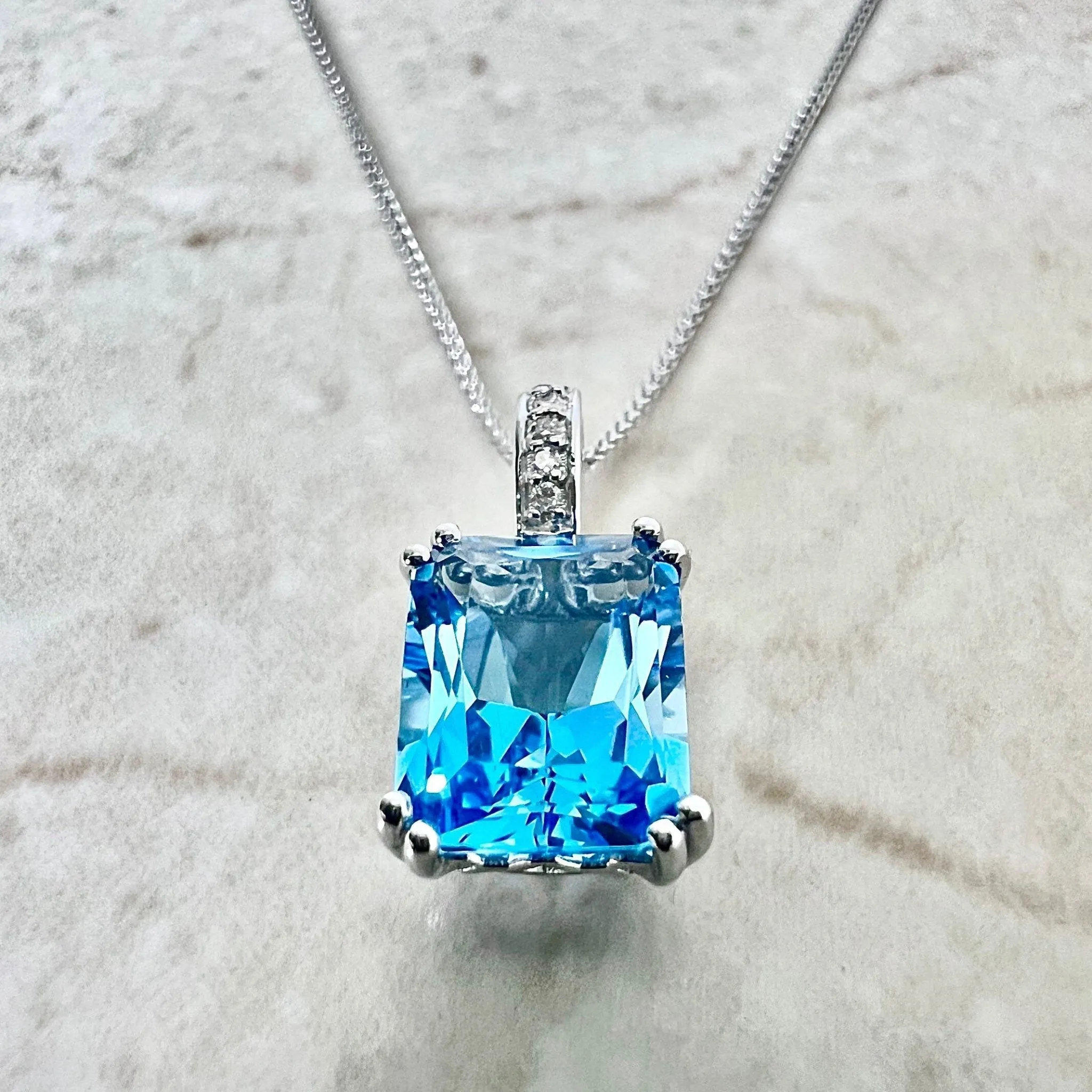 14 Karat White Gold Radiant Cut Swiss Blue Topaz & Diamond Ring And Pendant Necklace Set
