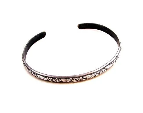 Sterling silver bracelet with floral design and patina