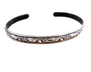 Sterling silver bracelet with floral design and patina